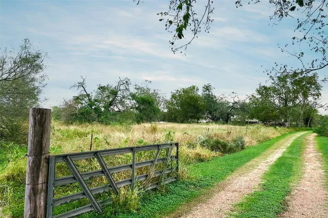a view of house with backyard