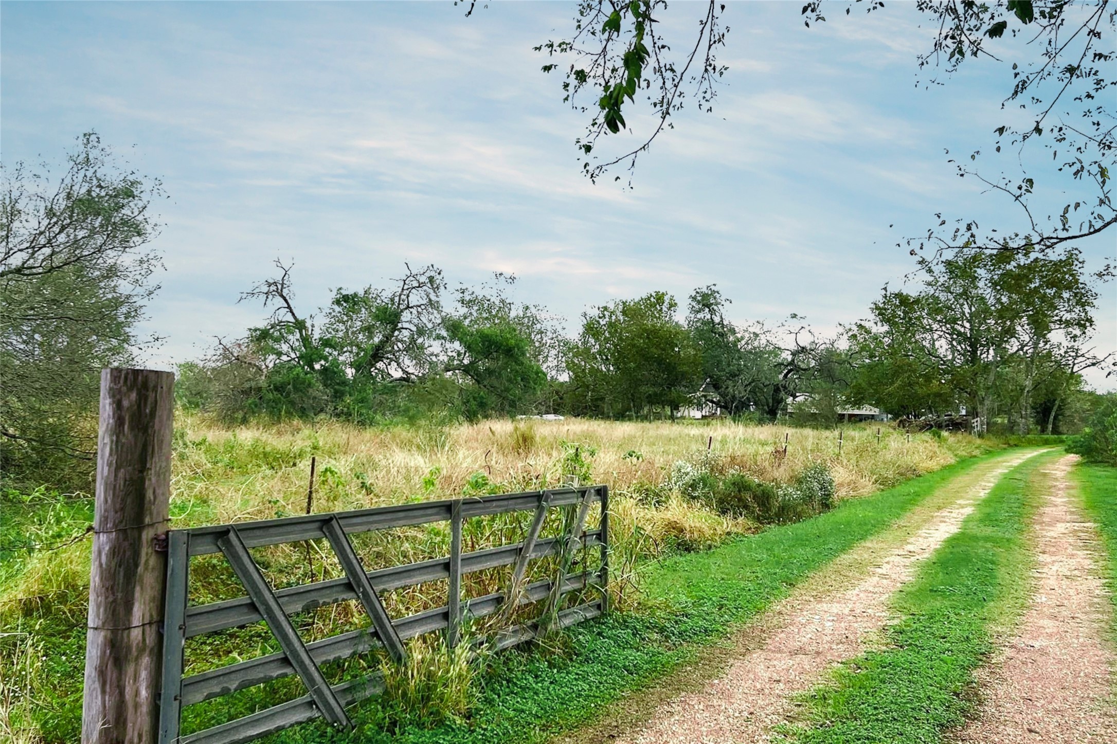 38440 Fisk Lane Pattison, TX 77423 - Photo 4 of 34 a view of a lake with a floor to ceiling window next to a yard