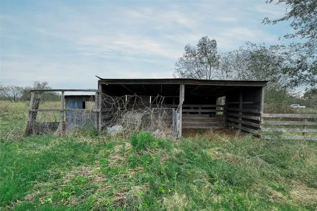 a backyard of a house with a garden and deck