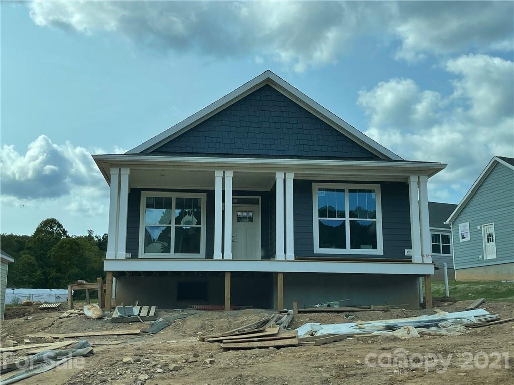 1209 Seven Sisters Road Black Mountain, NC 28711 - Photo 1 of 1 a front view of a house with a yard