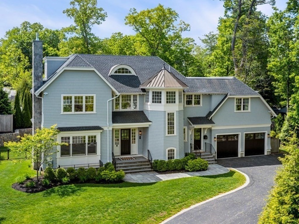 19 Crafts Road Brookline, MA 02467 - Photo 1 of 24 a front view of a house with a yard and garage