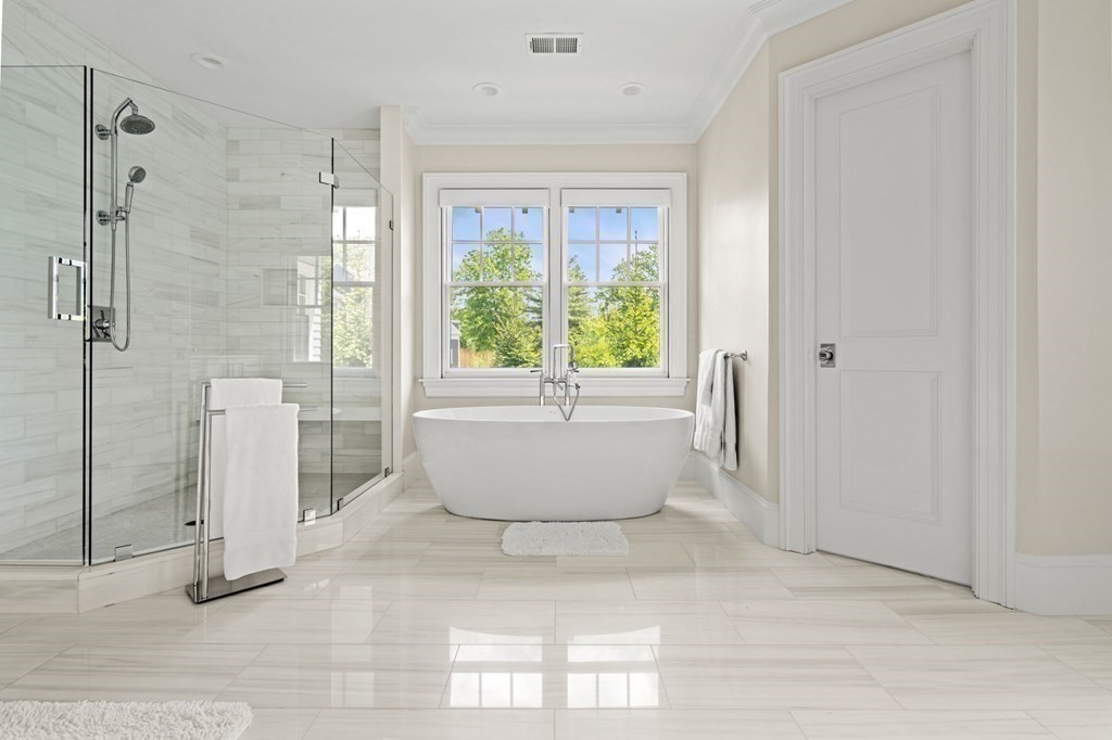 19 Crafts Road Brookline, MA 02467 - Photo 14 of 24 a white bath tub sitting next to a window