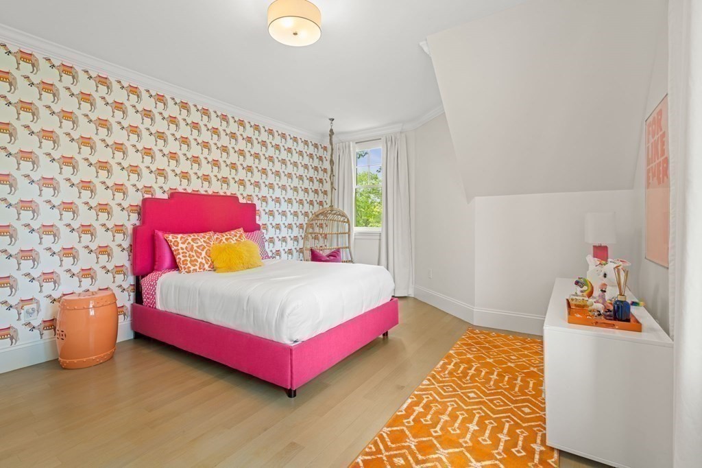 19 Crafts Road Brookline, MA 02467 - Photo 18 of 24 a bedroom with a bed and a potted plant