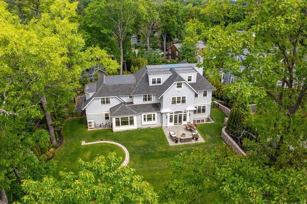 19 Crafts Road Brookline, MA 02467 - Photo 2 of 24 an aerial view of a house with swimming pool and large trees