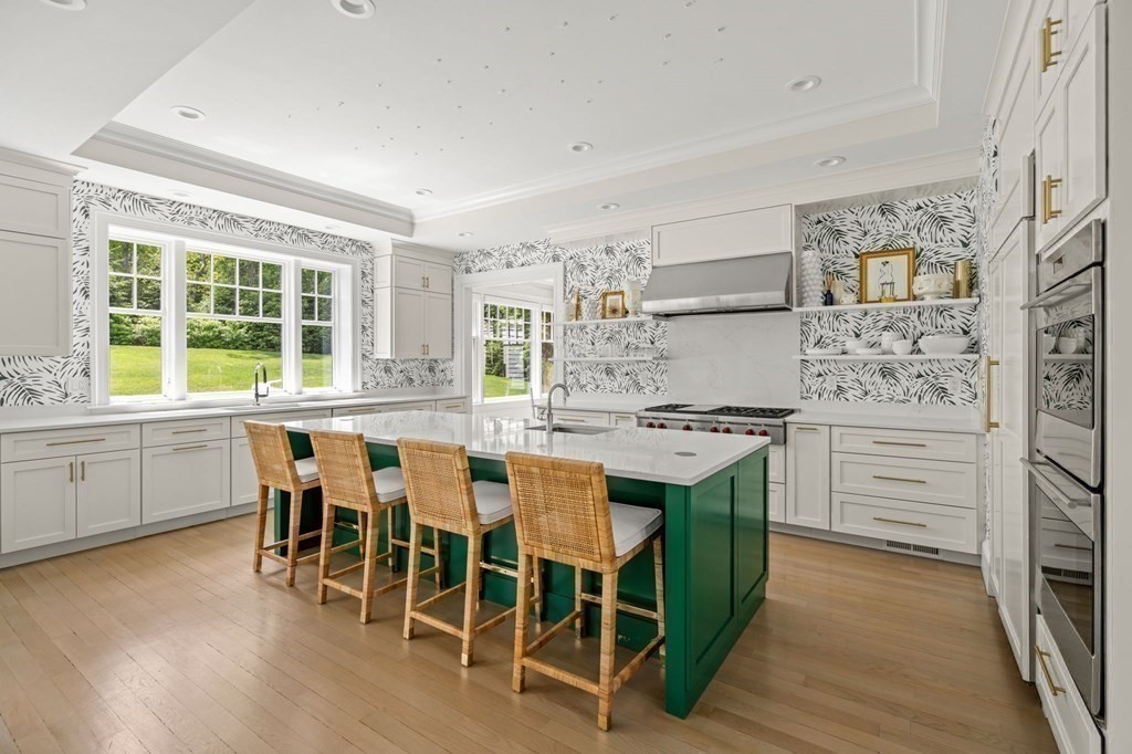 19 Crafts Road Brookline, MA 02467 - Photo 10 of 24 a kitchen with stainless steel appliances a stove a sink and a refrigerator