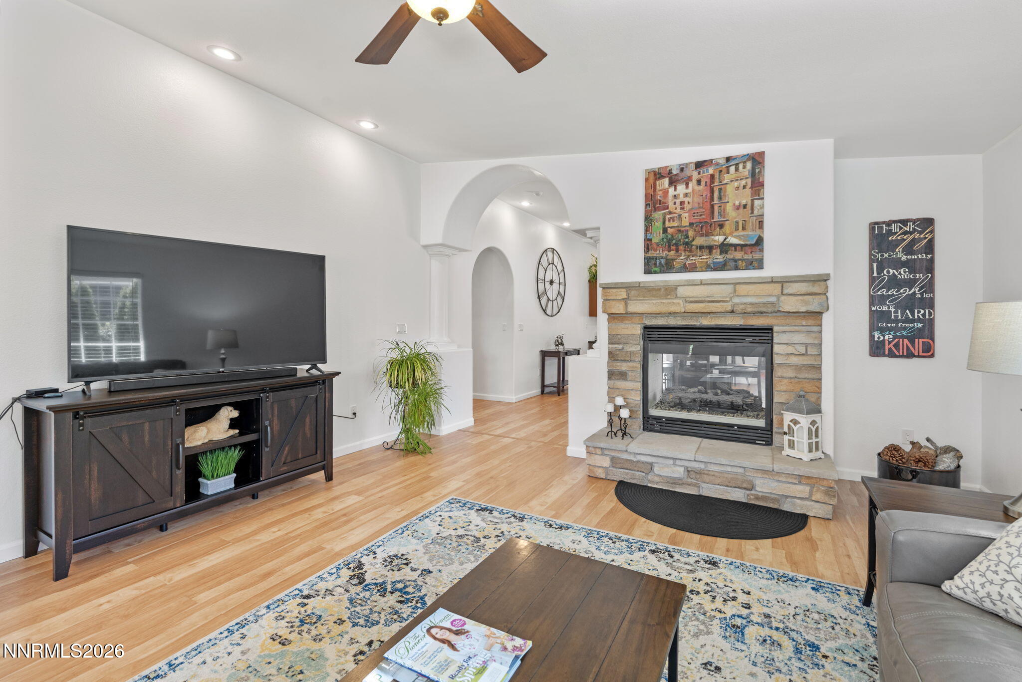 18324 Panda Bear Court Reno, NV 89508 - Photo 4 of 44 a living room with furniture a flat screen tv and a fireplace