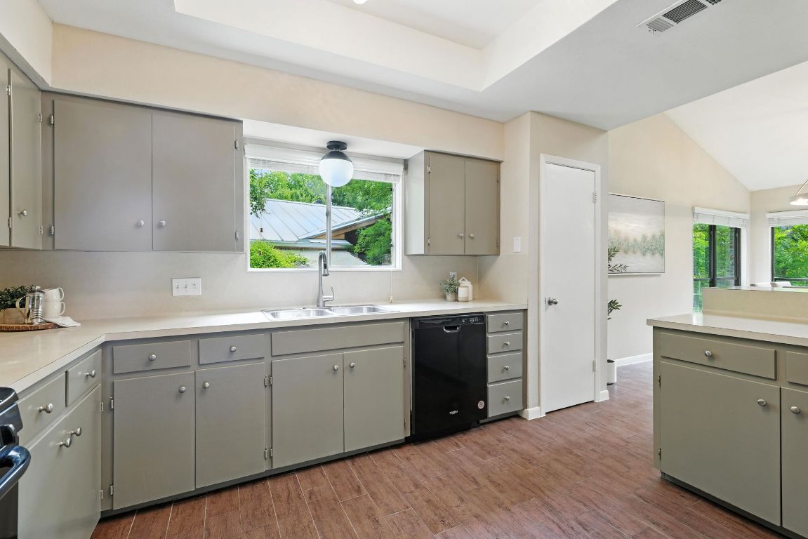11915 River Oaks Trail Austin, TX 78753 - Photo 12 of 32 a kitchen with a sink cabinets and window