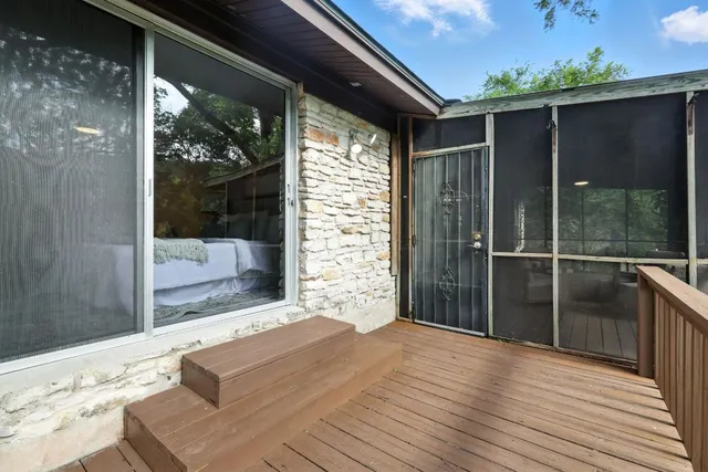 a outdoor space with sliding door and wooden floor