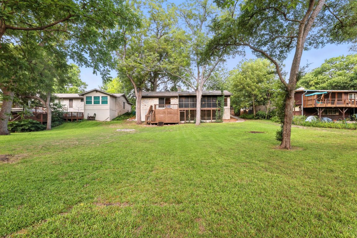 11915 River Oaks Trail Austin, TX 78753 - Photo 30 of 32 a view of a house with a big yard and large trees