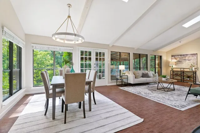 a view of a dining room with furniture window and wooden floor