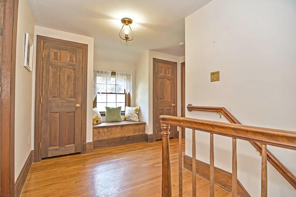 149 West Acton Road Stow, MA 01775 - Photo 18 of 42 a view of a hallway with wooden floor and a bathroom