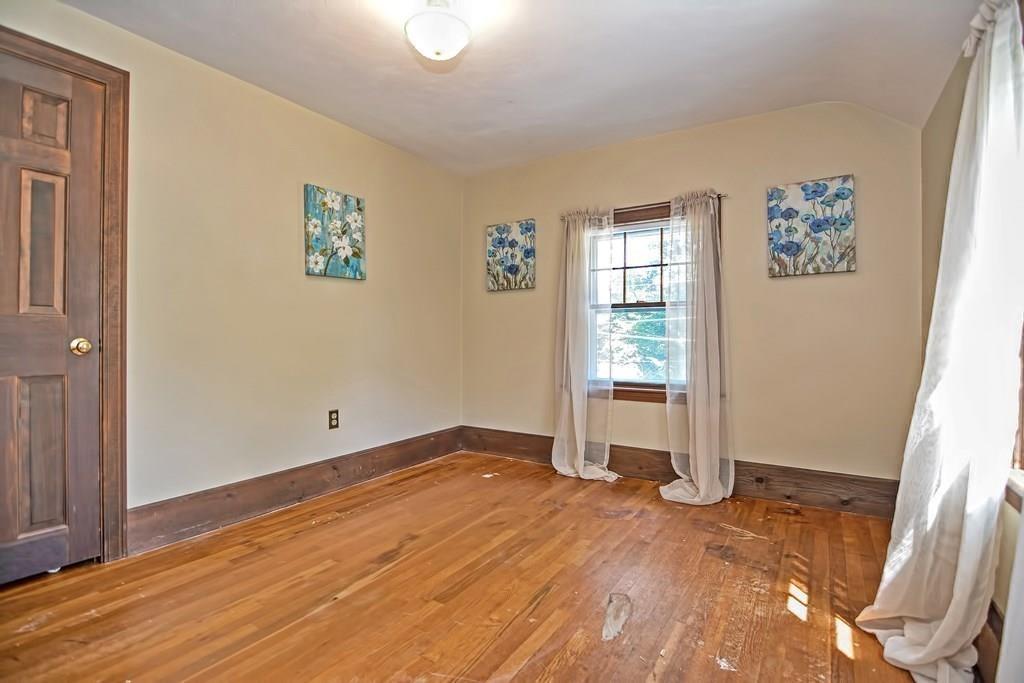 149 West Acton Road Stow, MA 01775 - Photo 19 of 42 wooden floor in an empty room with a window