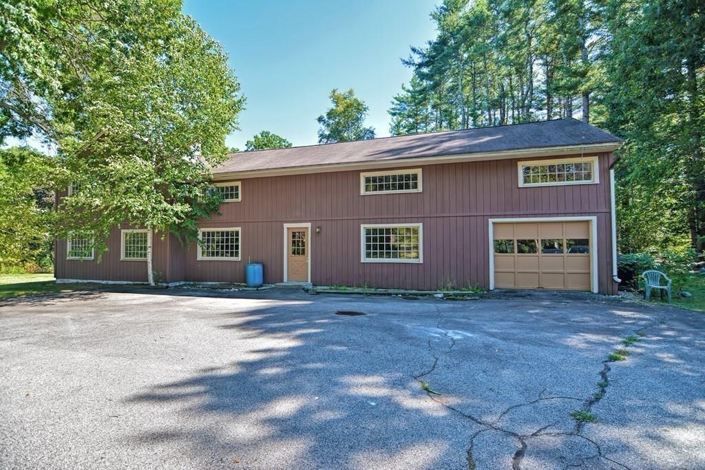 149 West Acton Road Stow, MA 01775 - Photo 2 of 42 a view of a house with a yard