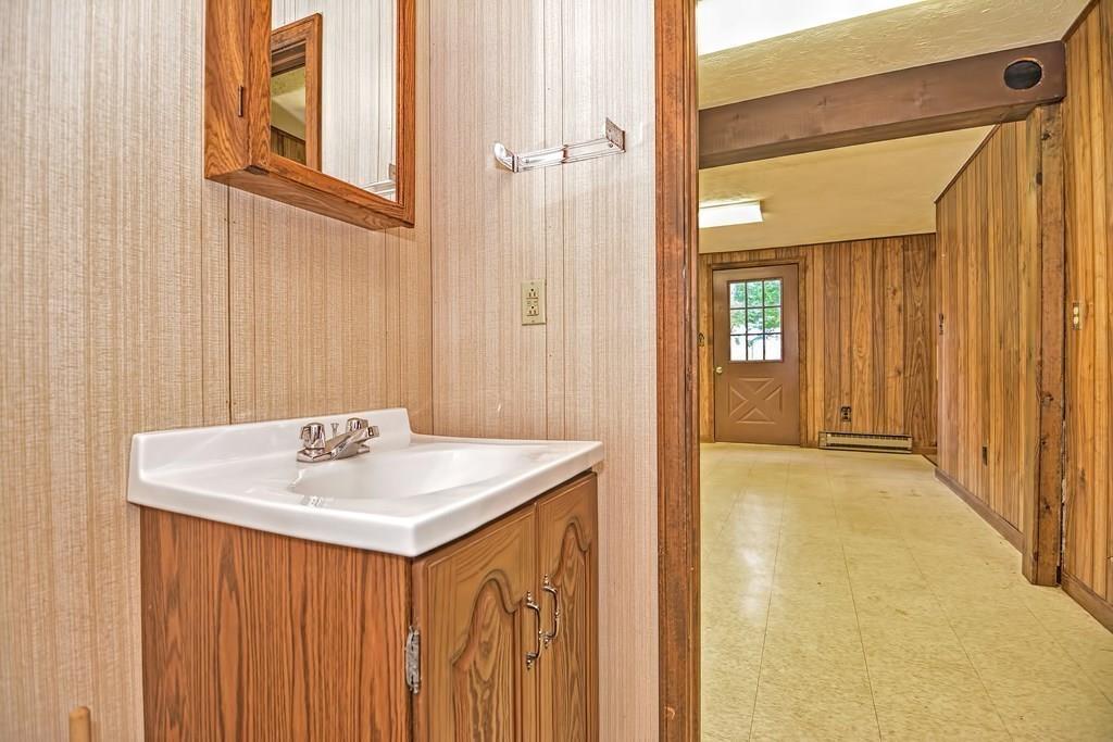 149 West Acton Road Stow, MA 01775 - Photo 34 of 42 a bathroom with a sink a mirror and a shower