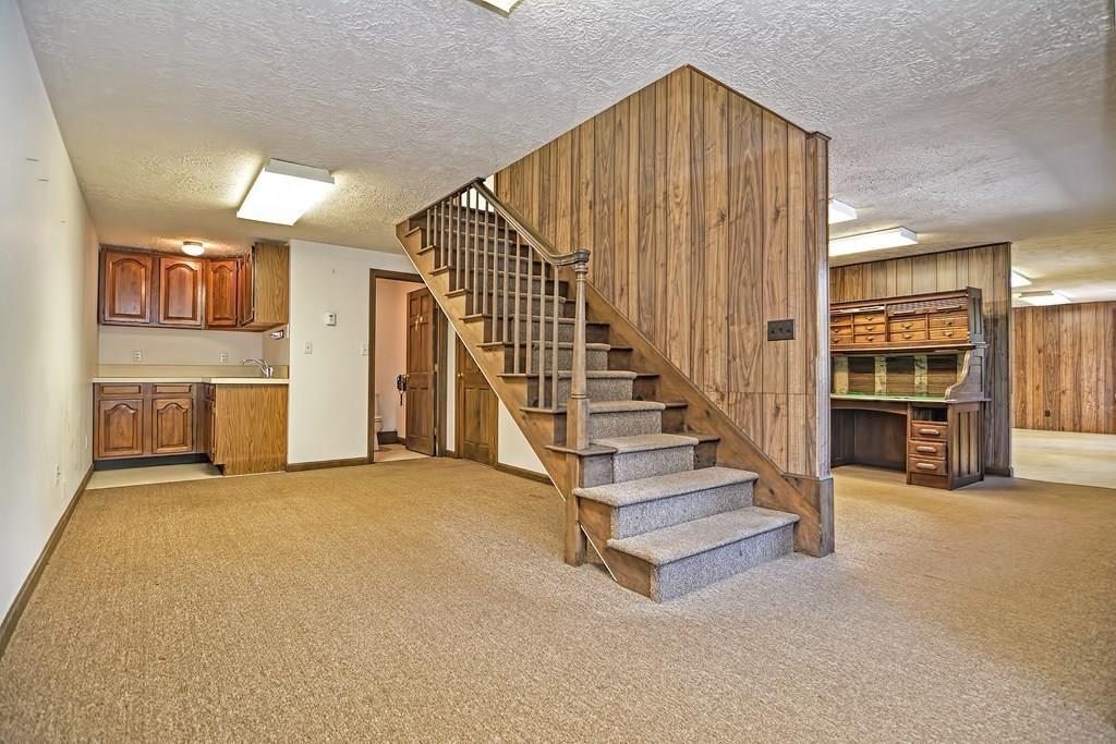 149 West Acton Road Stow, MA 01775 - Photo 37 of 42 a view of front door with hallway and stairs