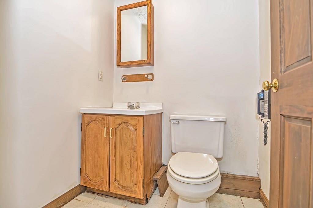 149 West Acton Road Stow, MA 01775 - Photo 38 of 42 a bathroom with a granite countertop toilet and a sink