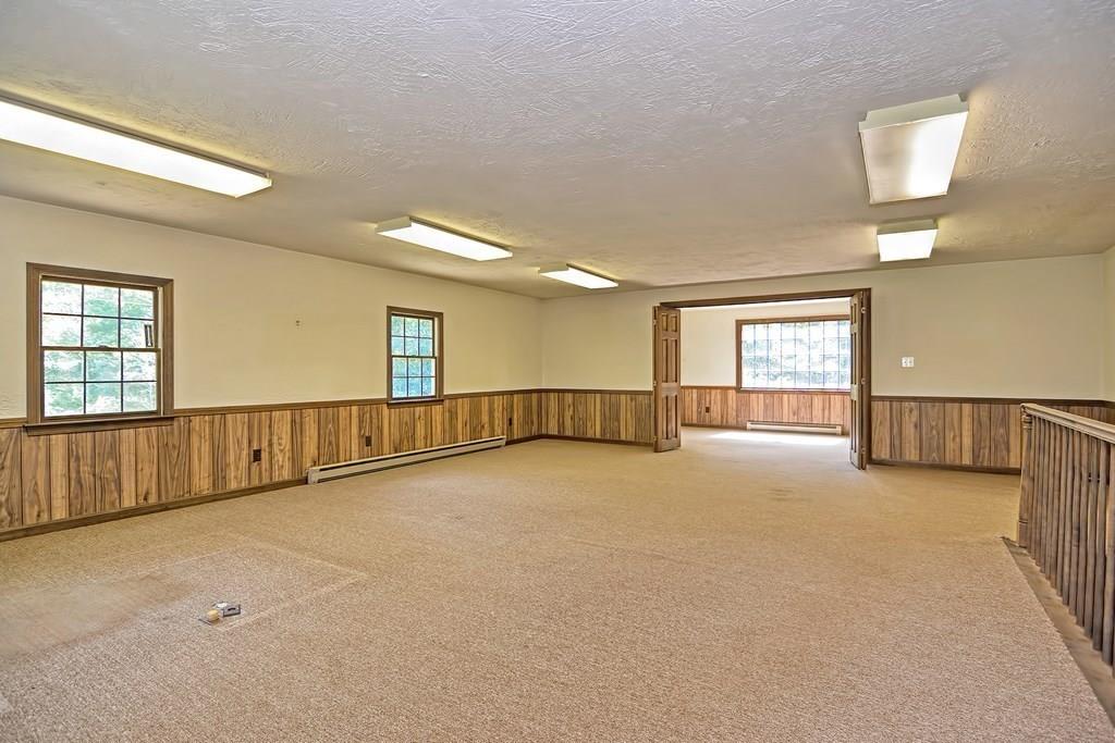 149 West Acton Road Stow, MA 01775 - Photo 40 of 42 a view of an empty room with windows