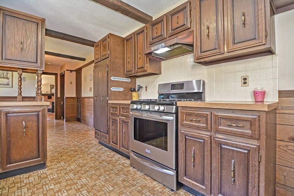 149 West Acton Road Stow, MA 01775 - Photo 9 of 42 a kitchen with stainless steel appliances granite countertop a refrigerator and cabinets