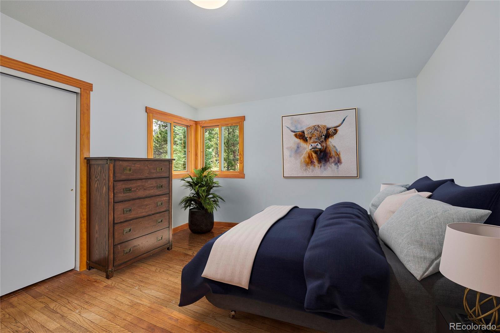 347 East Kelly Road Boulder, CO 80302 - Photo 11 of 29 a bed room with a bed and a dresser