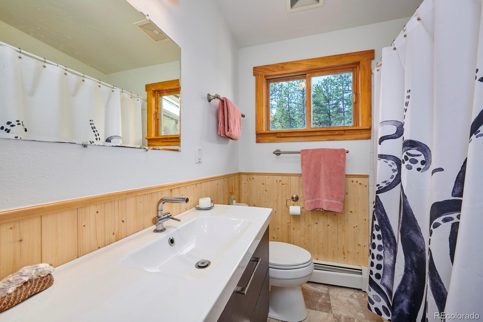 347 East Kelly Road Boulder, CO 80302 - Photo 12 of 29 a bathroom with a sink and a mirror