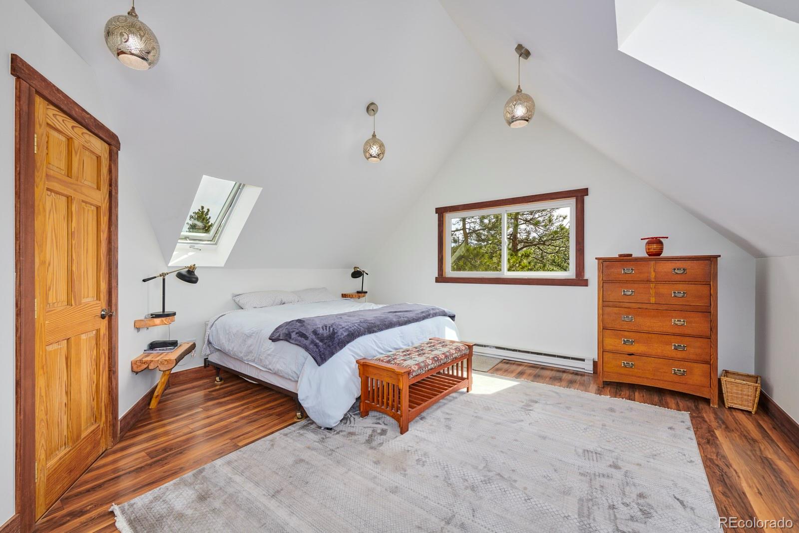 347 East Kelly Road Boulder, CO 80302 - Photo 13 of 29 a spacious bedroom with a bed and a window