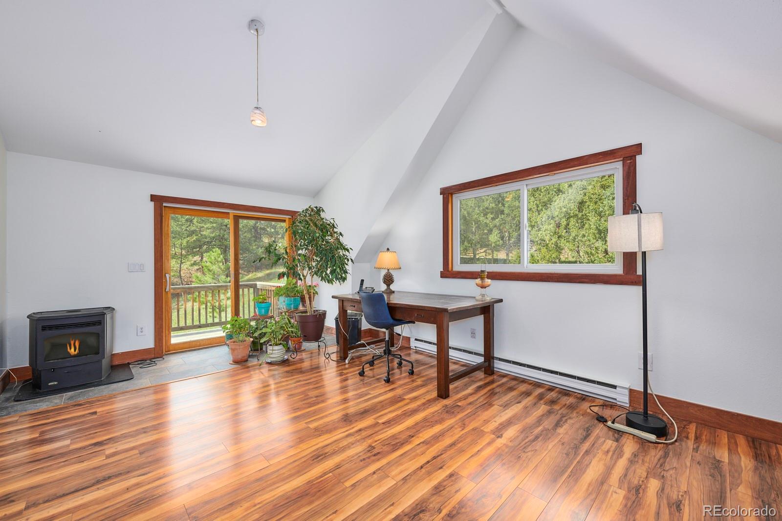 347 East Kelly Road Boulder, CO 80302 - Photo 15 of 29 a workspace with furniture window and wooden floor