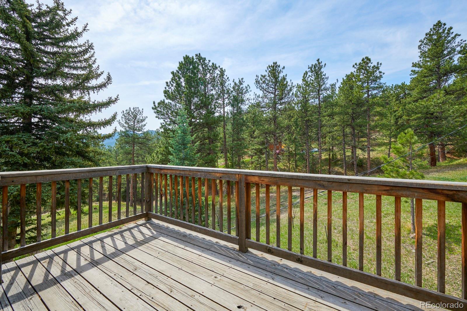 347 East Kelly Road Boulder, CO 80302 - Photo 16 of 29 a view of balcony with wooden floor and fence