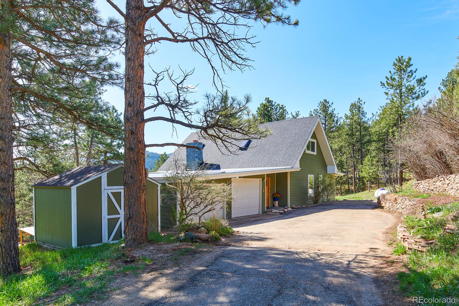 347 East Kelly Road Boulder, CO 80302 - Photo 4 of 29 a front view of a house with garden