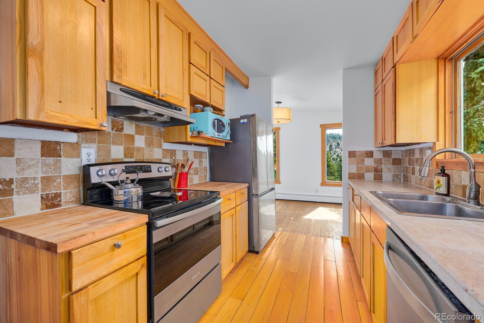 347 East Kelly Road Boulder, CO 80302 - Photo 9 of 29 a kitchen that has a sink and a stove