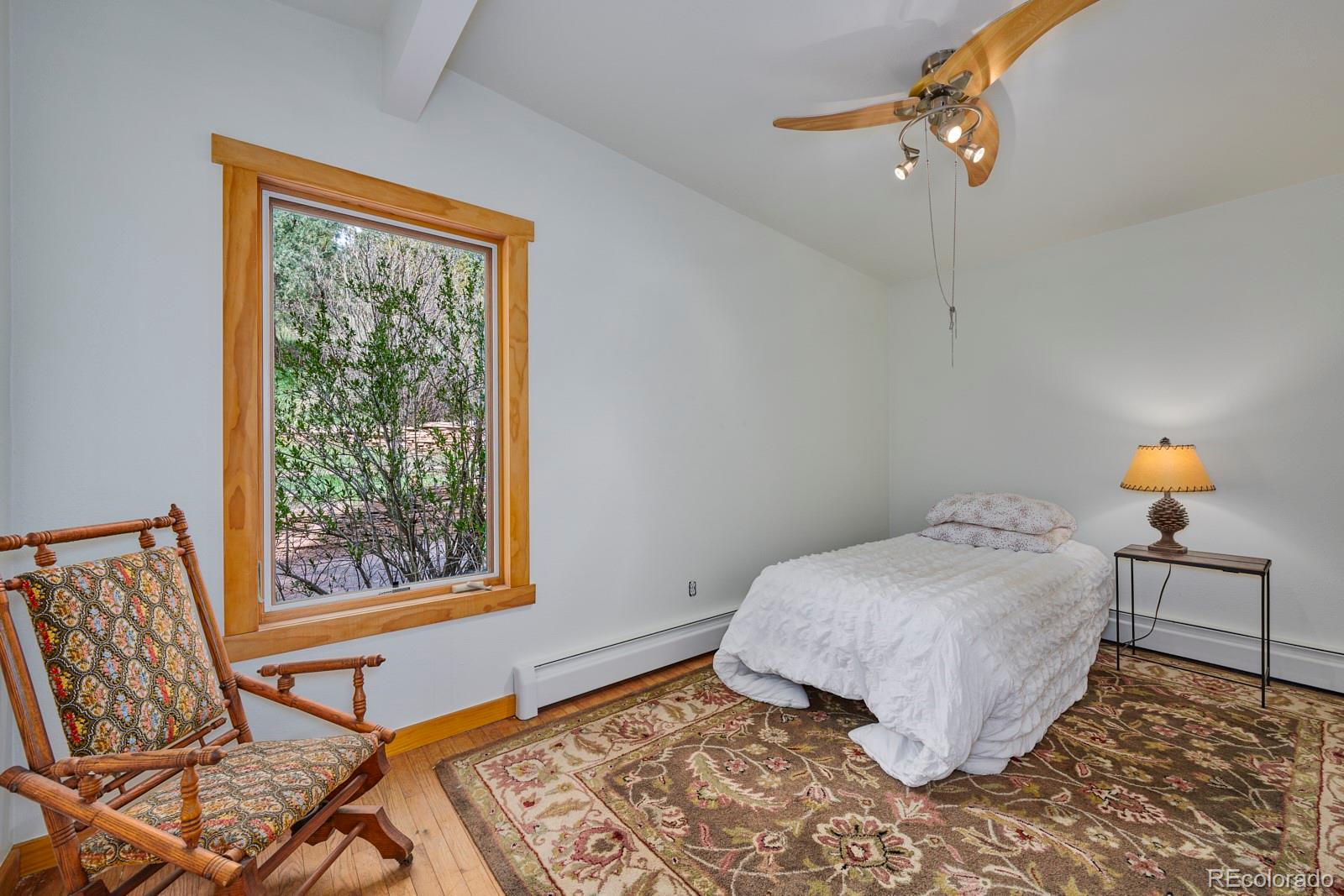 347 East Kelly Road Boulder, CO 80302 - Photo 10 of 29 a bedroom with a bed and window