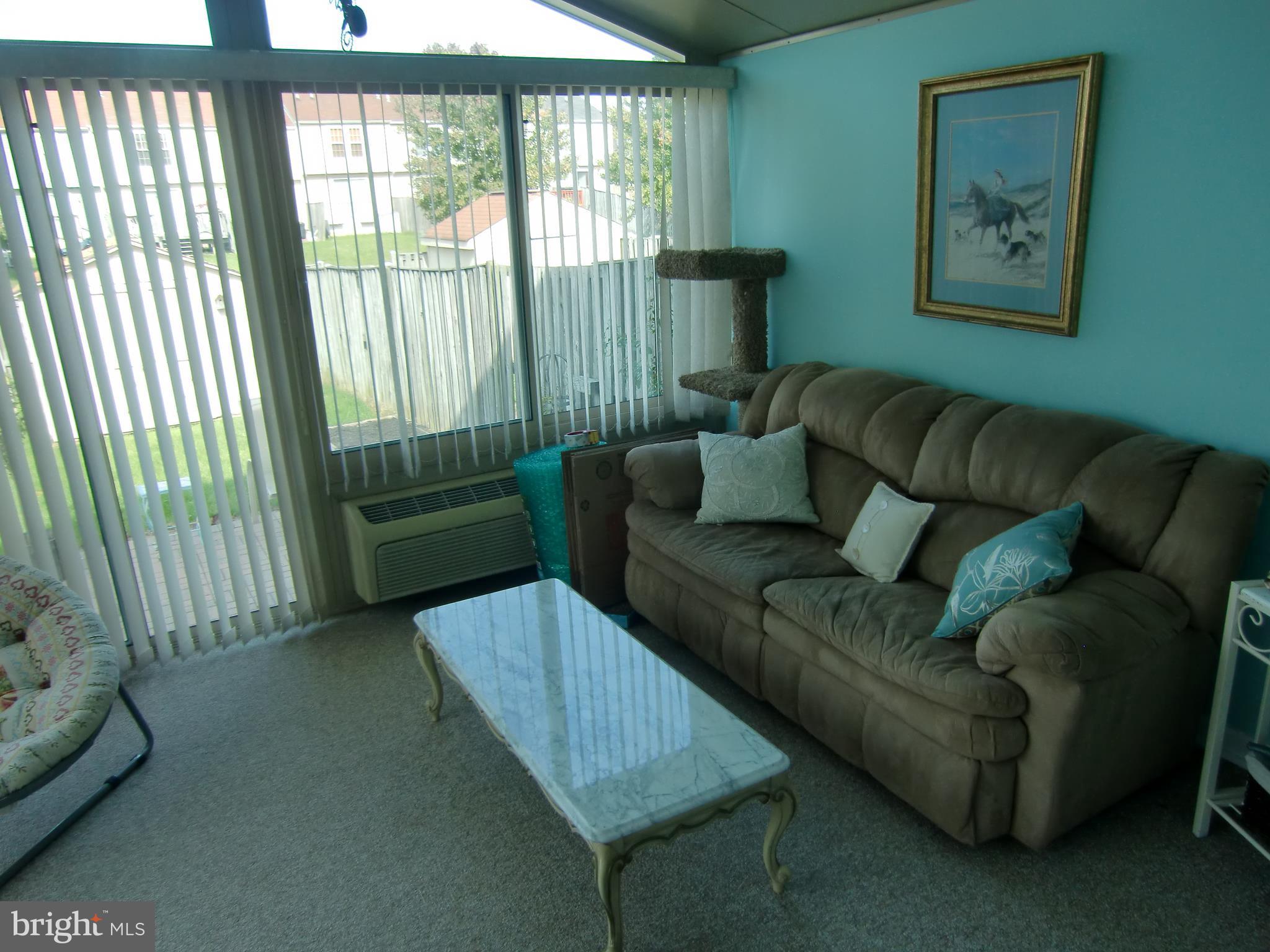 2236 Riding Crop Way Baltimore, MD 21244 - Photo 11 of 25 a living room with furniture and a window