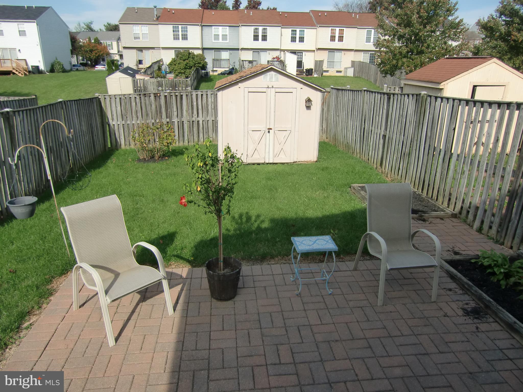2236 Riding Crop Way Baltimore, MD 21244 - Photo 14 of 25 a view of backyard with patio and outdoor seating