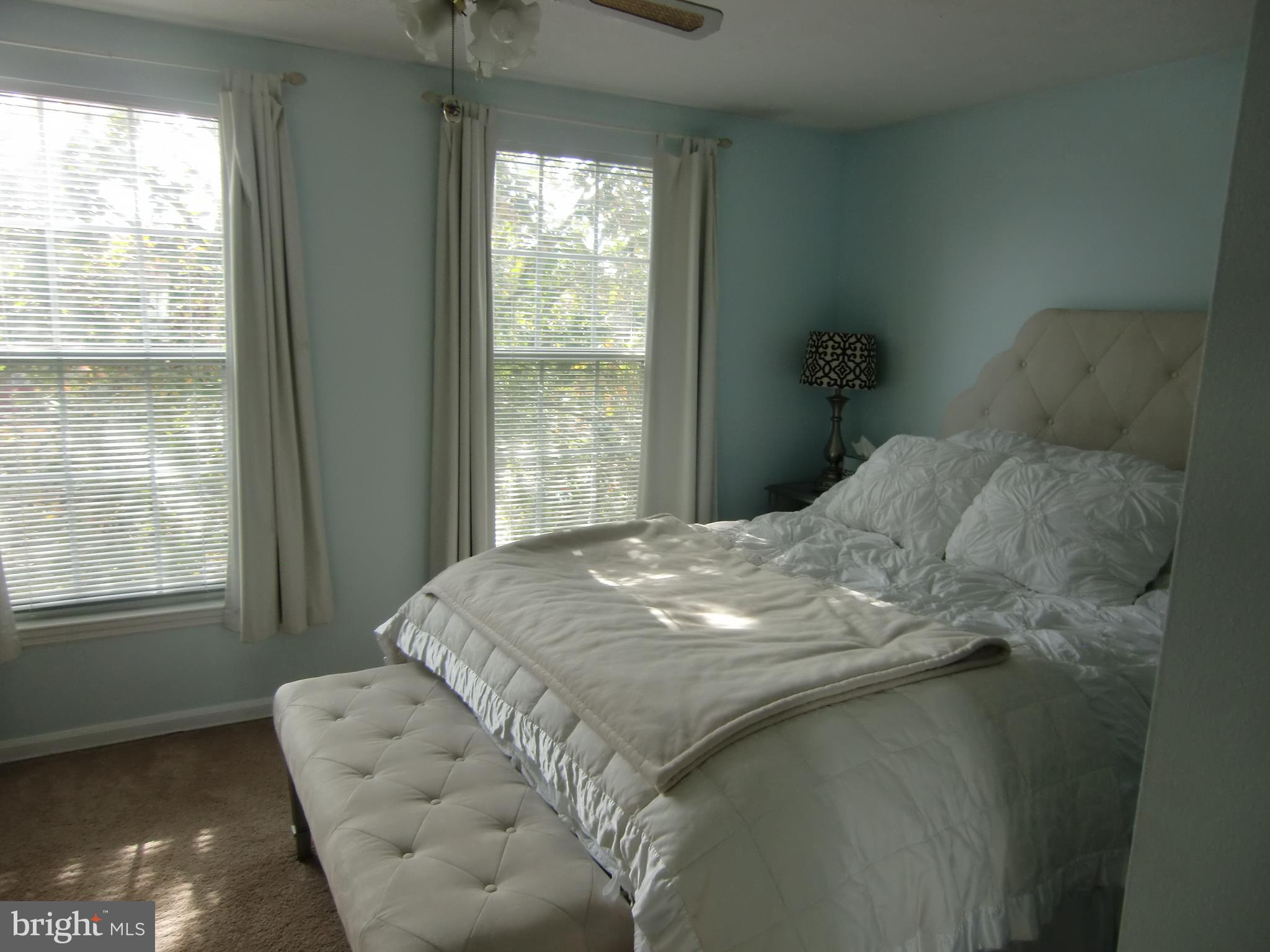 2236 Riding Crop Way Baltimore, MD 21244 - Photo 17 of 25 a bed sitting in a bedroom next to a window