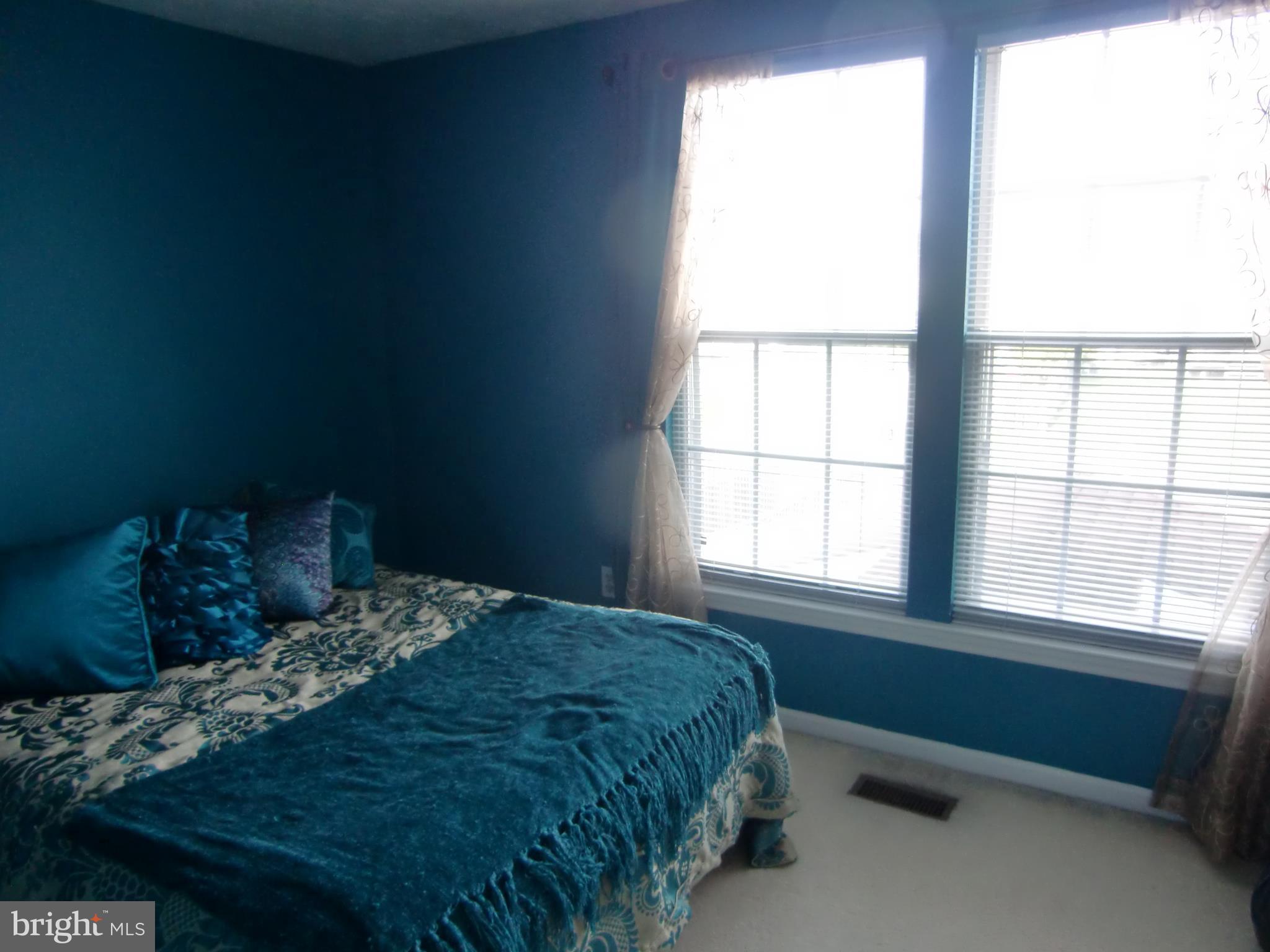 2236 Riding Crop Way Baltimore, MD 21244 - Photo 20 of 25 a bedroom with a bed and a window