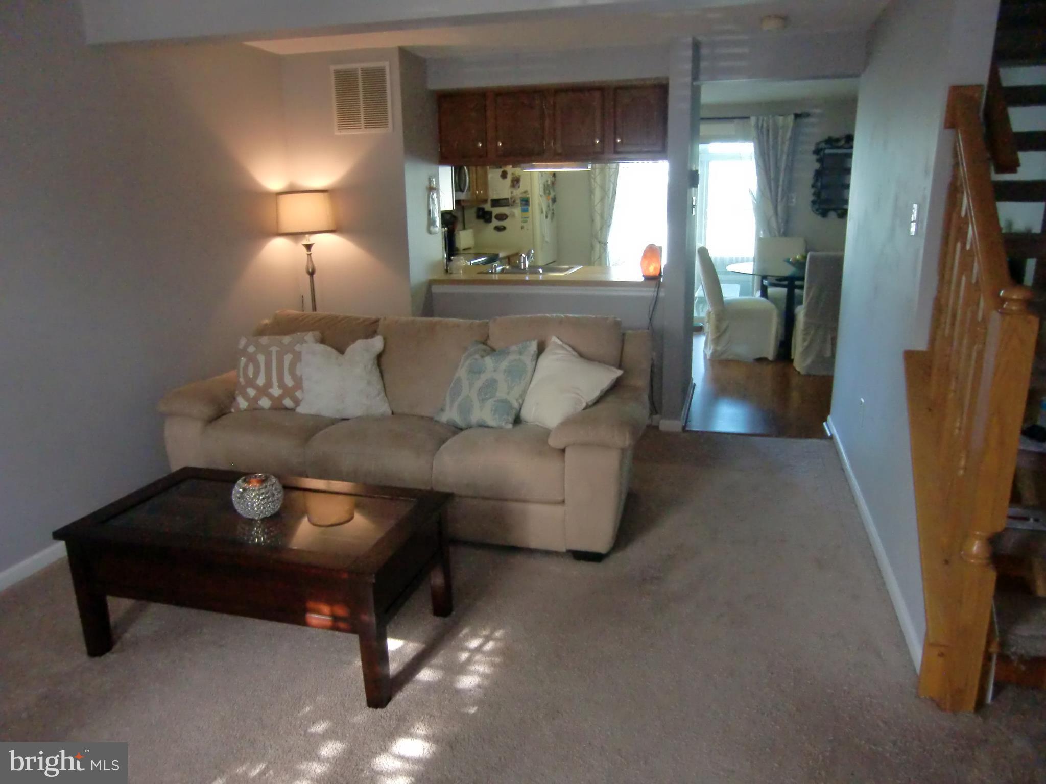 2236 Riding Crop Way Baltimore, MD 21244 - Photo 3 of 25 a living room with furniture and a fireplace