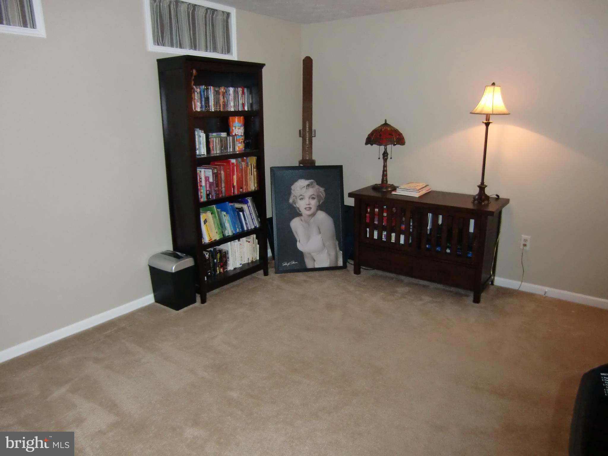 2236 Riding Crop Way Baltimore, MD 21244 - Photo 23 of 25 a bedroom with bed and a bookshelf