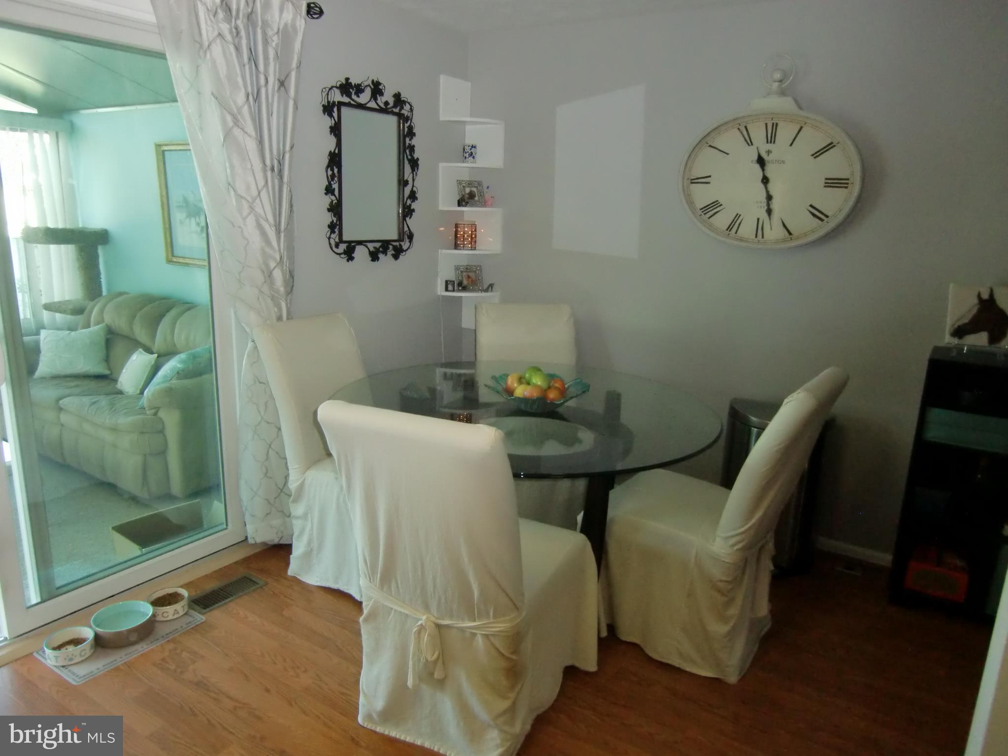 2236 Riding Crop Way Baltimore, MD 21244 - Photo 7 of 25 a view of a dining room with furniture and wooden floor