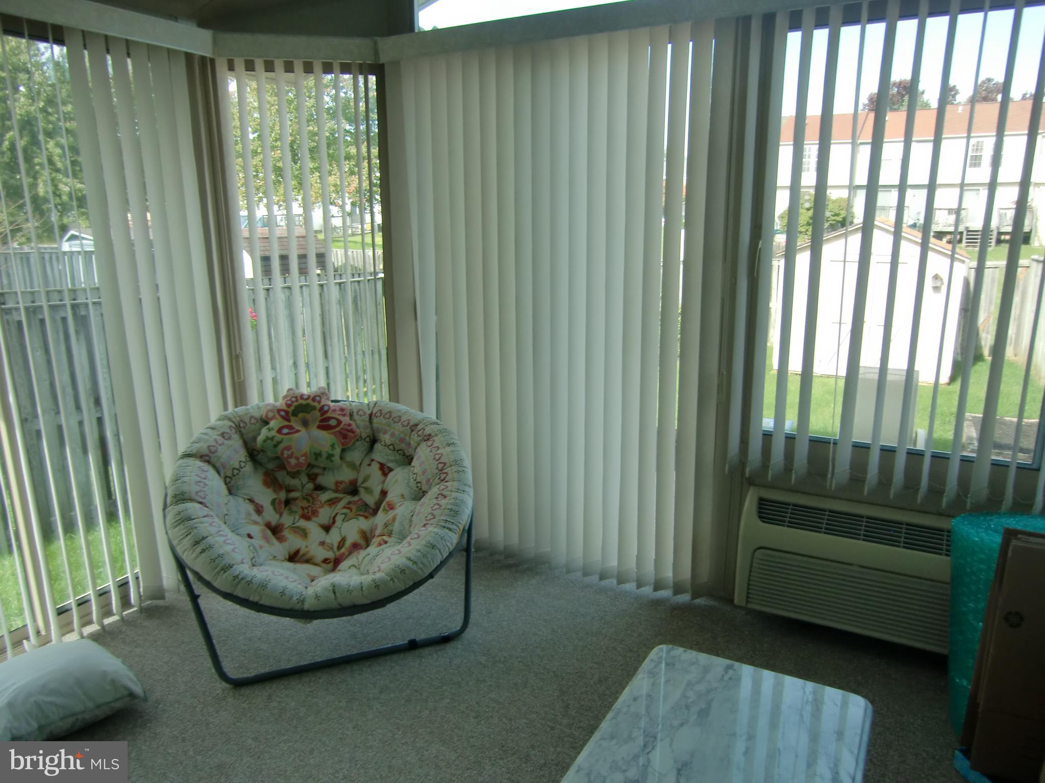 2236 Riding Crop Way Baltimore, MD 21244 - Photo 10 of 25 a living room with furniture and a gate