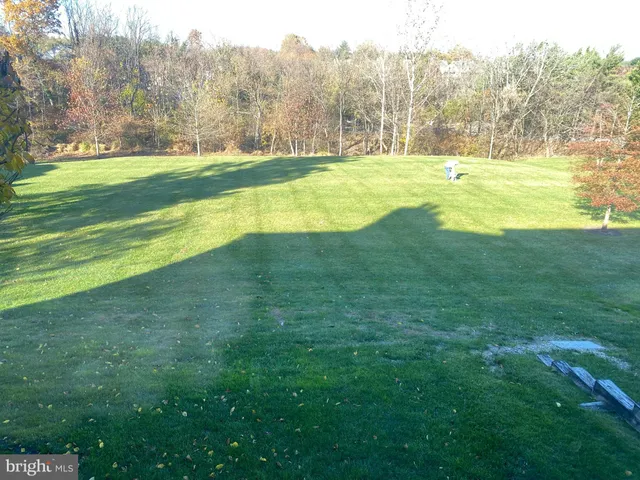 a view of a yard with an outdoor space and seating area