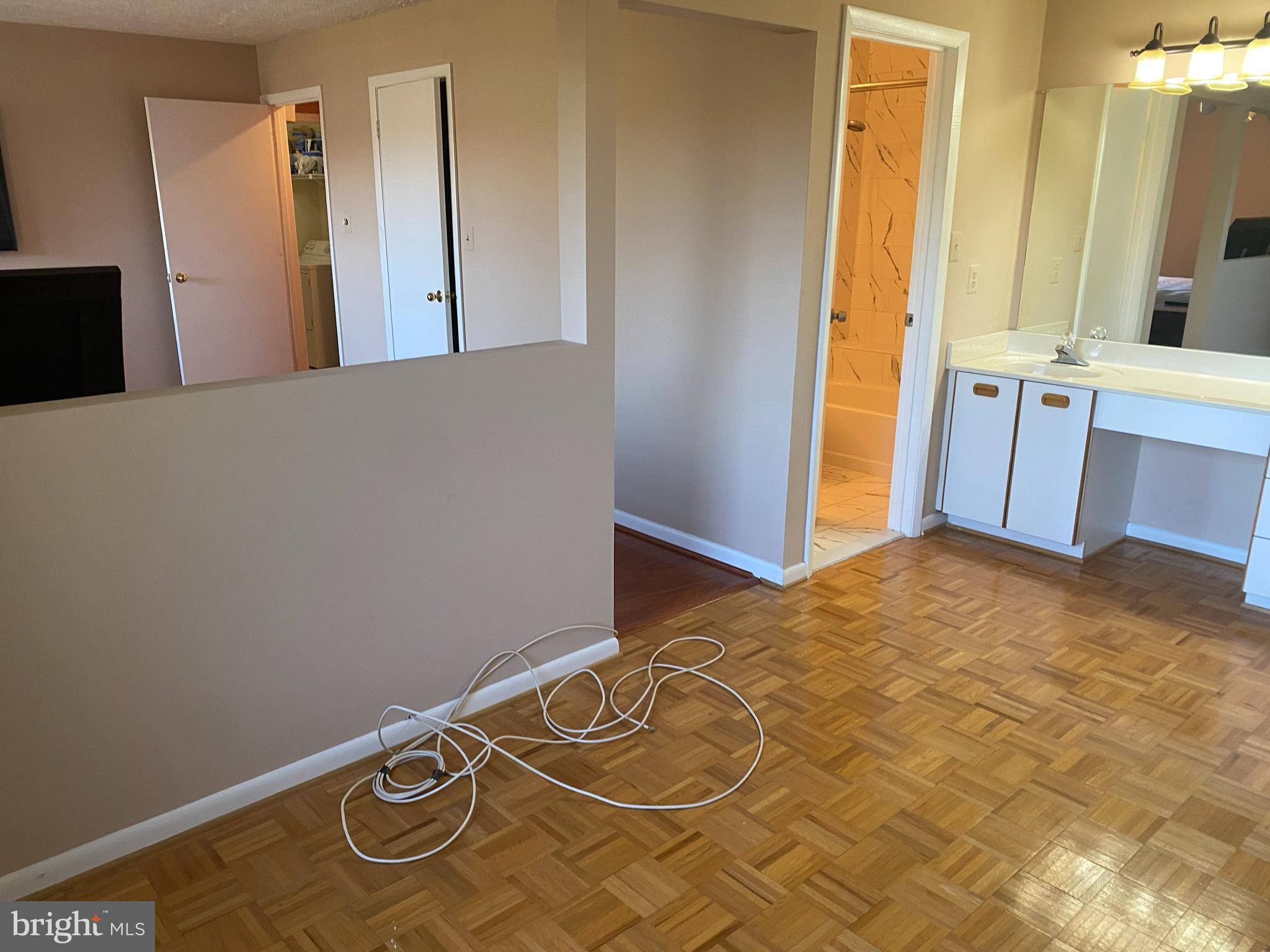 2109 B Woodbox Lane, Unit 2109B Baltimore, MD 21209 - Photo 17 of 26 a view of a room with wooden floor