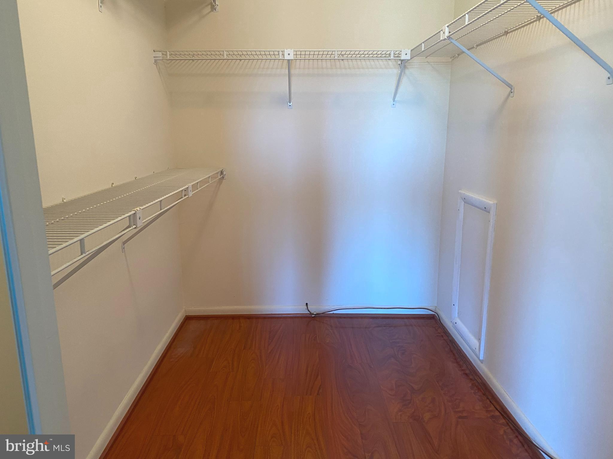 2109 B Woodbox Lane, Unit 2109B Baltimore, MD 21209 - Photo 20 of 26 a view of a room with racks on the wall