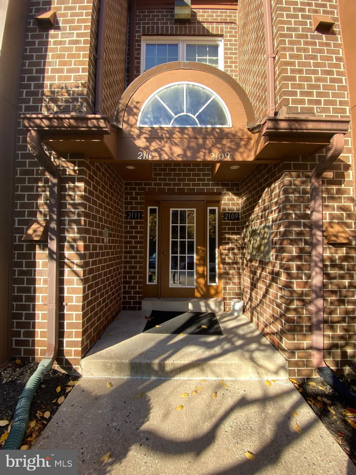 2109 B Woodbox Lane, Unit 2109B Baltimore, MD 21209 - Photo 2 of 26 a view of a building with a door front of house