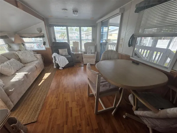 a living room with furniture and a table