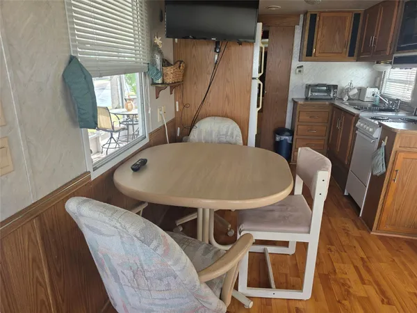 a dining room with furniture and window