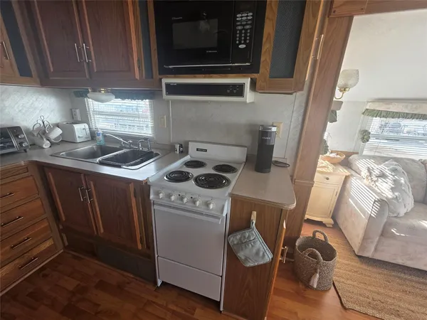 a utility room with sink dryer and washer