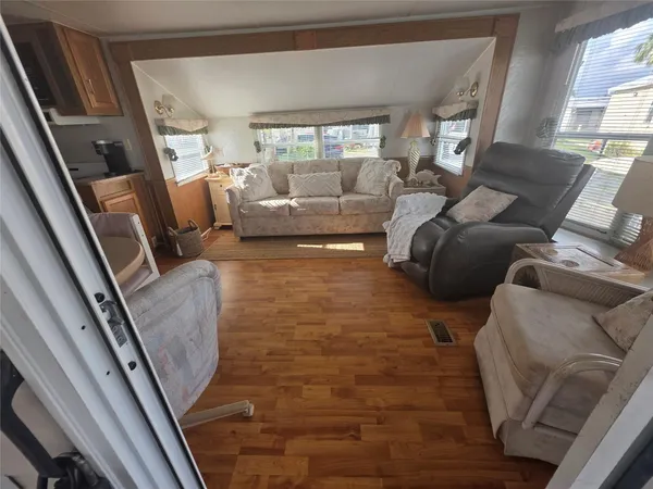 a living room with furniture and a large window