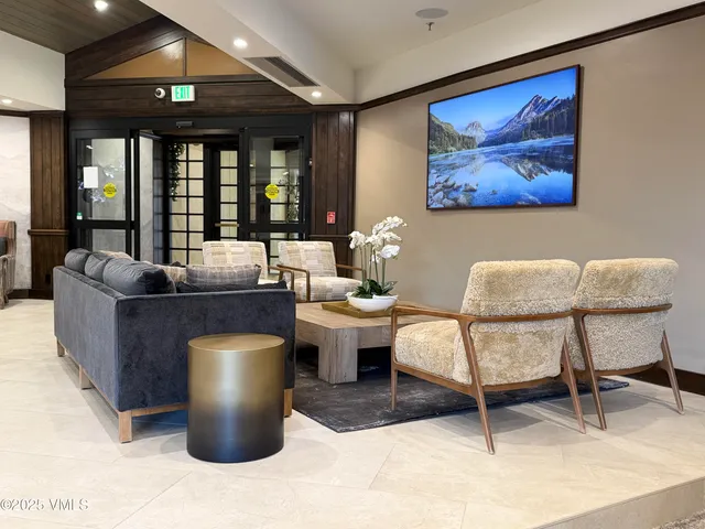 a living room with furniture a window and a fireplace