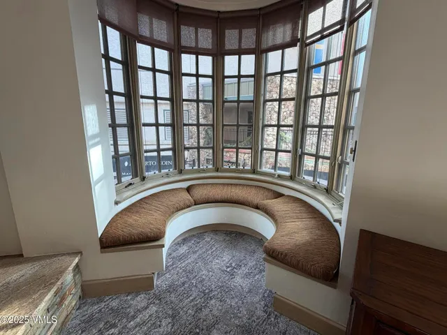 a living room with a couch and a rug