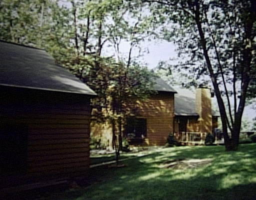314 Old Warren Road Palmer, MA 01069 - Photo 1 of 1 a view of a yard in front of a house with a large tree