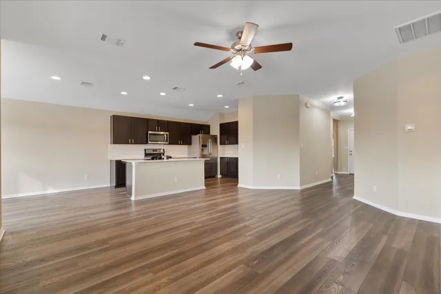 a view of kitchen with cabinets and wooden floor